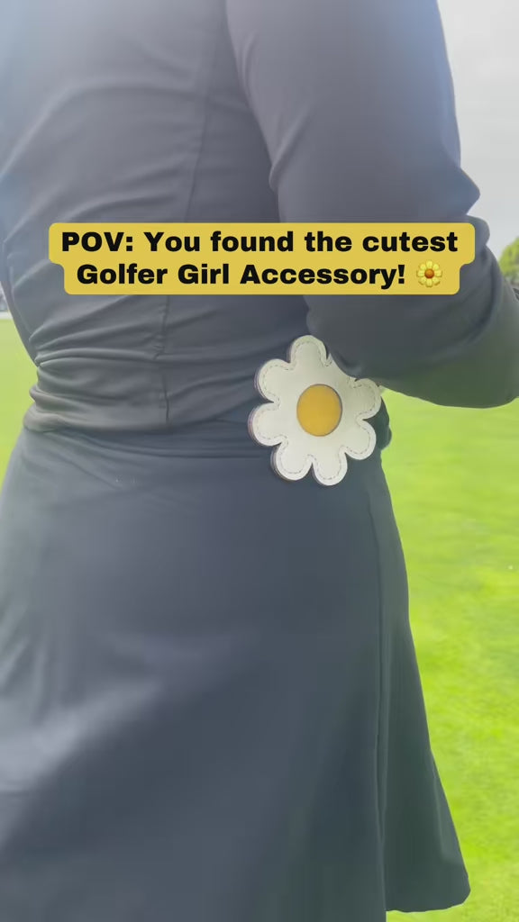 Video of Daisy Golf Glove Holder Clipped onto waistband and Golf Glove being secured to velcro pad.