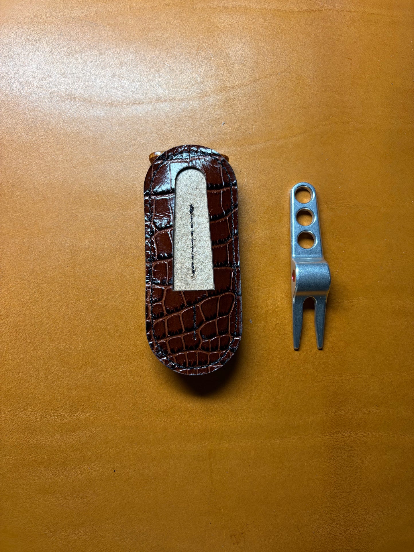 Scotty Cameron Pivot Tool & Golf Tee Holder. Pocket for 1.5 inch Ball Marker. Embossed Crocodile and Natural Veg Tan leather.