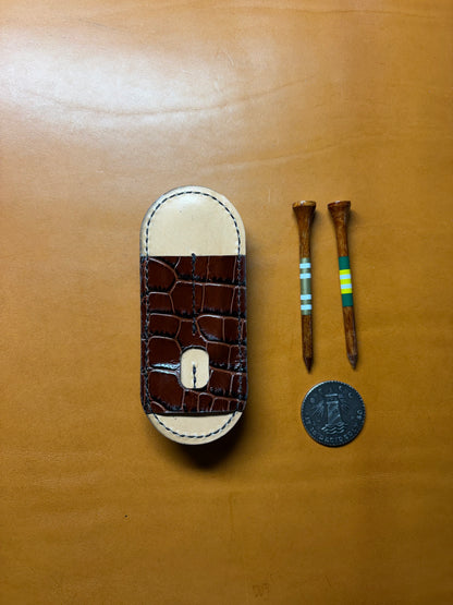 Scotty Cameron Pivot Tool & Golf Tee Holder. Pocket for 1.5 inch Ball Marker. Embossed Crocodile and Natural Veg Tan leather.