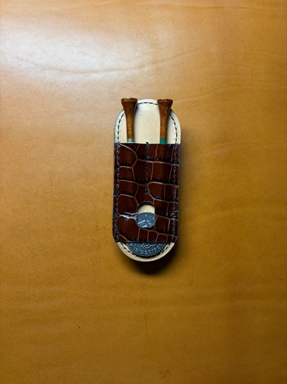 Scotty Cameron Pivot Tool & Golf Tee Holder. Pocket for 1.5 inch Ball Marker. Embossed Crocodile and Natural Veg Tan leather.