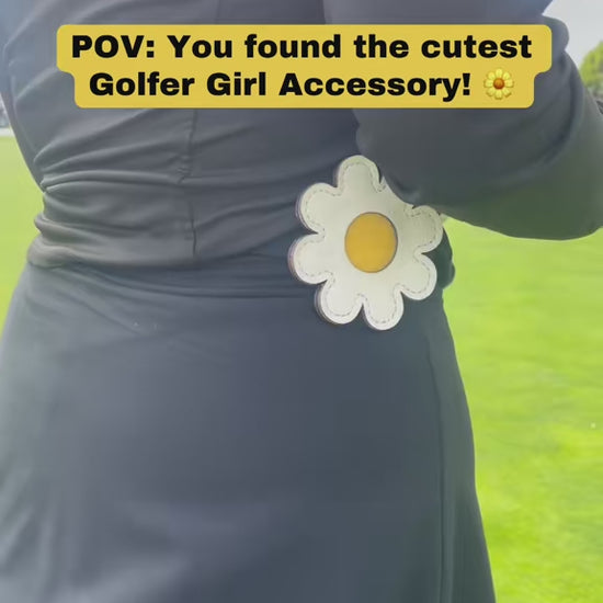Video of Daisy Golf Glove Holder Clipped onto waistband and Golf Glove being secured to velcro pad.
